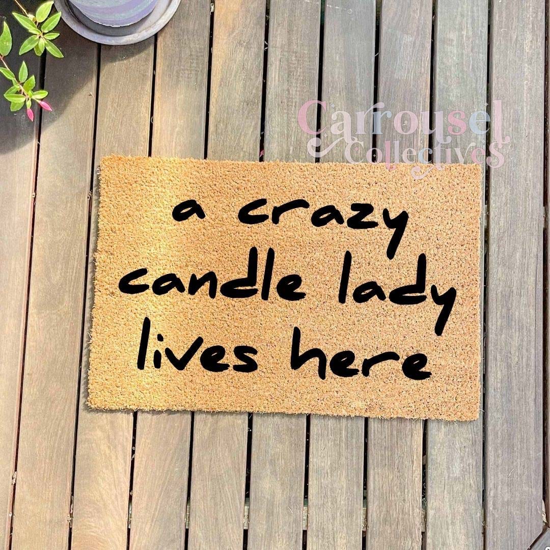 A crazy candle lady lives here doormat, custom doormat, personalised doormat, door mat